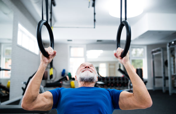 Baby Boomer Man working out in gym 